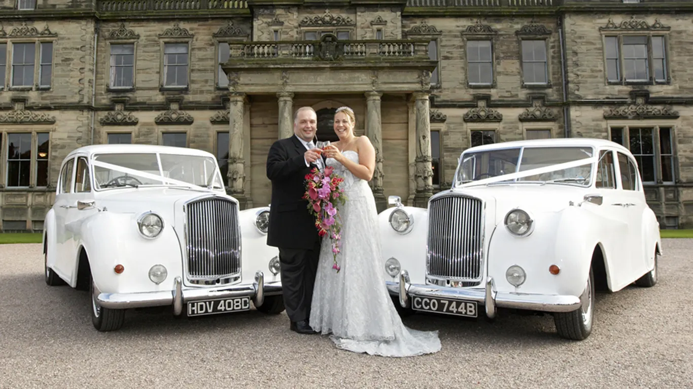 Classic 7-seater Austin Princess Limousine with Bride and Groom celebrating