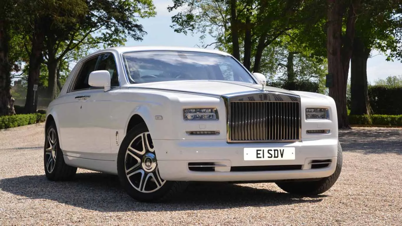Modern White Rolls-Royce Phantom with Wedding Ribbons