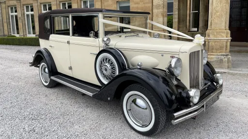 Black & Ivory 6-seater Vintage Regent Convertible decorated with White Ribbons