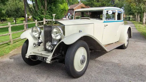 1930's Vintage Rolls-Royce in Ivory for hire in Surrey. Front view shoing the Rolls-Royce Mascot and tall chrome grill