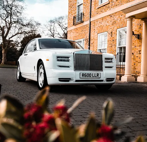 White Rolls-Royce Phantom Series 2 waiting outside a wedding venue in Surrey