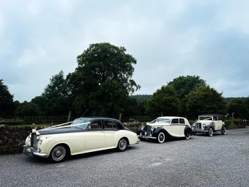 Two Classic Cars and one Vintage Wedding Car on way to a wedding in South Yorkshire Countryside