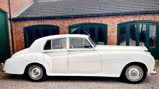 Side view of White Classic Rolls-Royce silver Cloud in Essex
