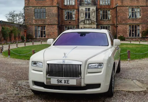Front view of white modern Rolls-Royce in front of wedidng venue in Worcestershire