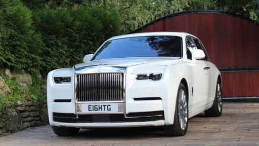 Rolls-Royce Phantom 8 for hire in Hertfordshire witing for bride and her father outside collection address.