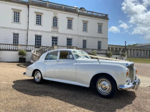 Classic Bentley at queen's house in Greenwich London. Decorated with cream ribbons