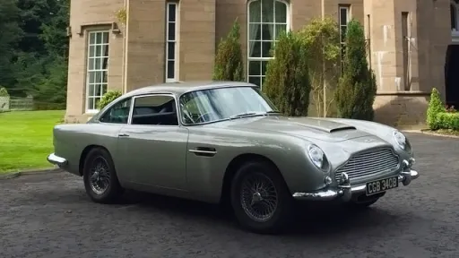 Side view of the iconic Classic Aston Martin DB5 showing the famous Aston Martin Grill