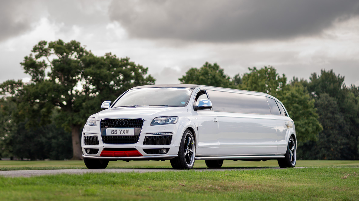 Modern white Audi Q7 stretched limousine entering a local wedding venue in Wigan.
