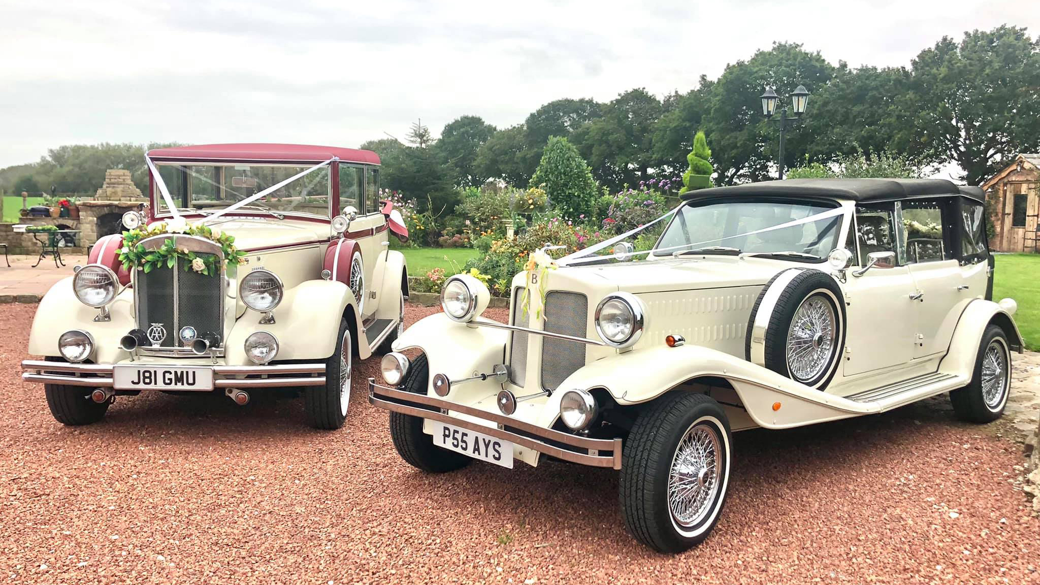 Two vintage wedding cars decorated with white ribbons and bows at a local Lytham St Anne's wedding. Both vehicles are parked side-by-side