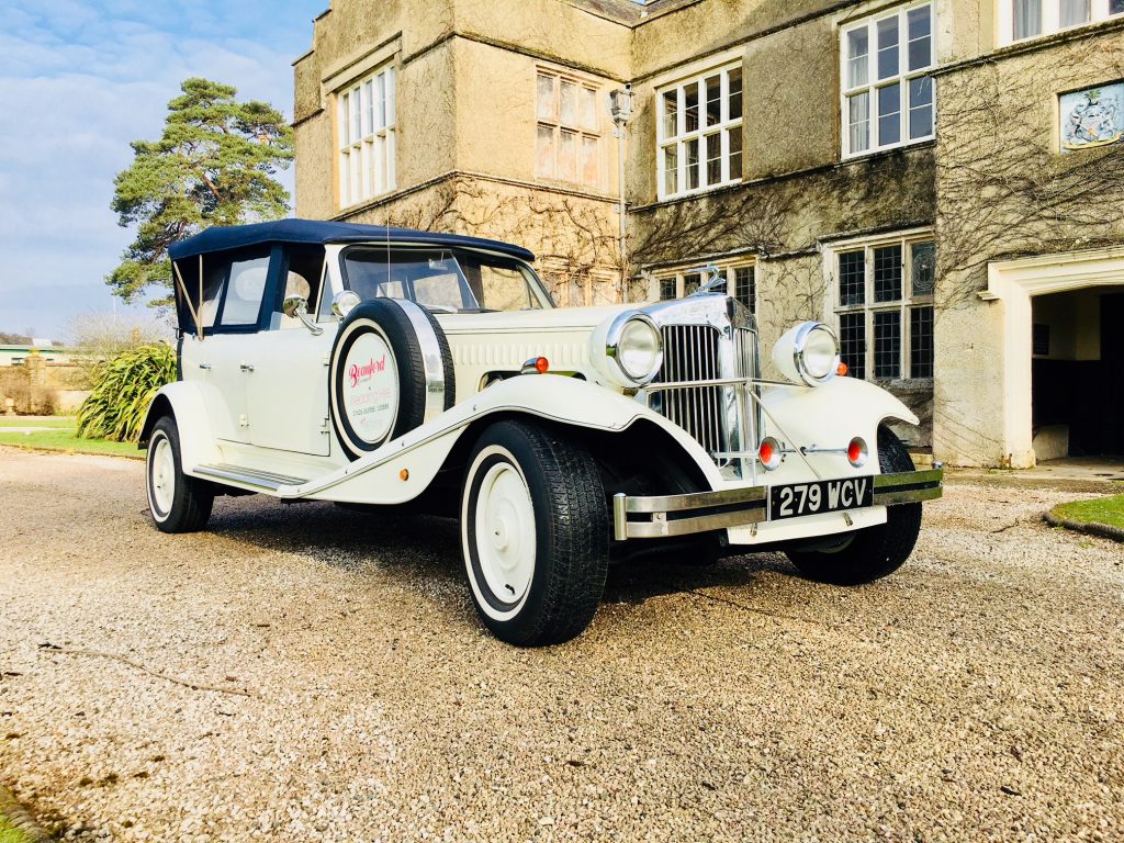 Ivory Beauford with Roof Up in front of wedding venue