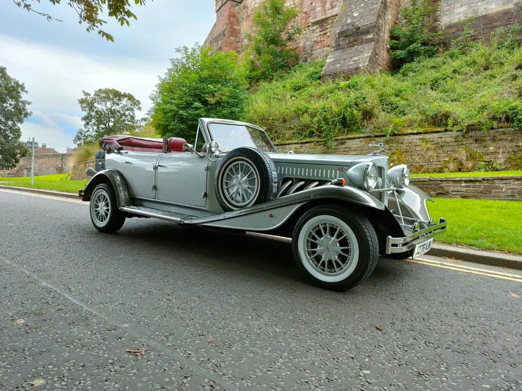 Side View of our Silver Beauford with Roof Open showing Burgundy Leather interior