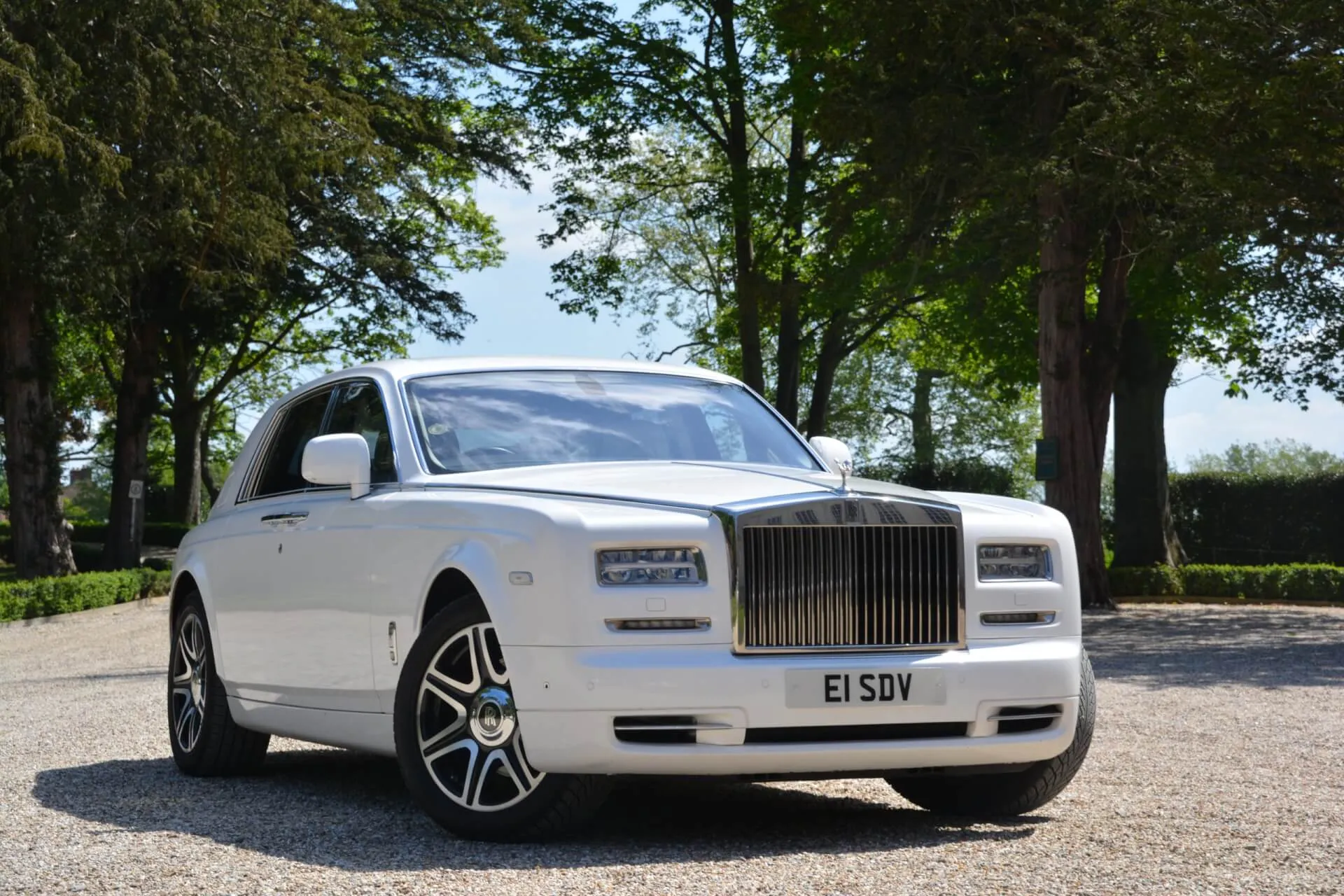 Side view of a Modern White rolls-Royce Phantom in Woodbridge