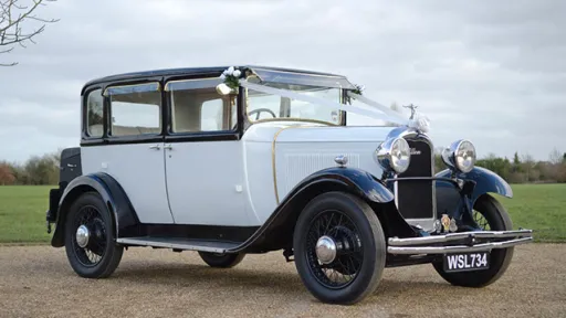 White French Vintage Citroen Car with white ribbons and black wheel arches