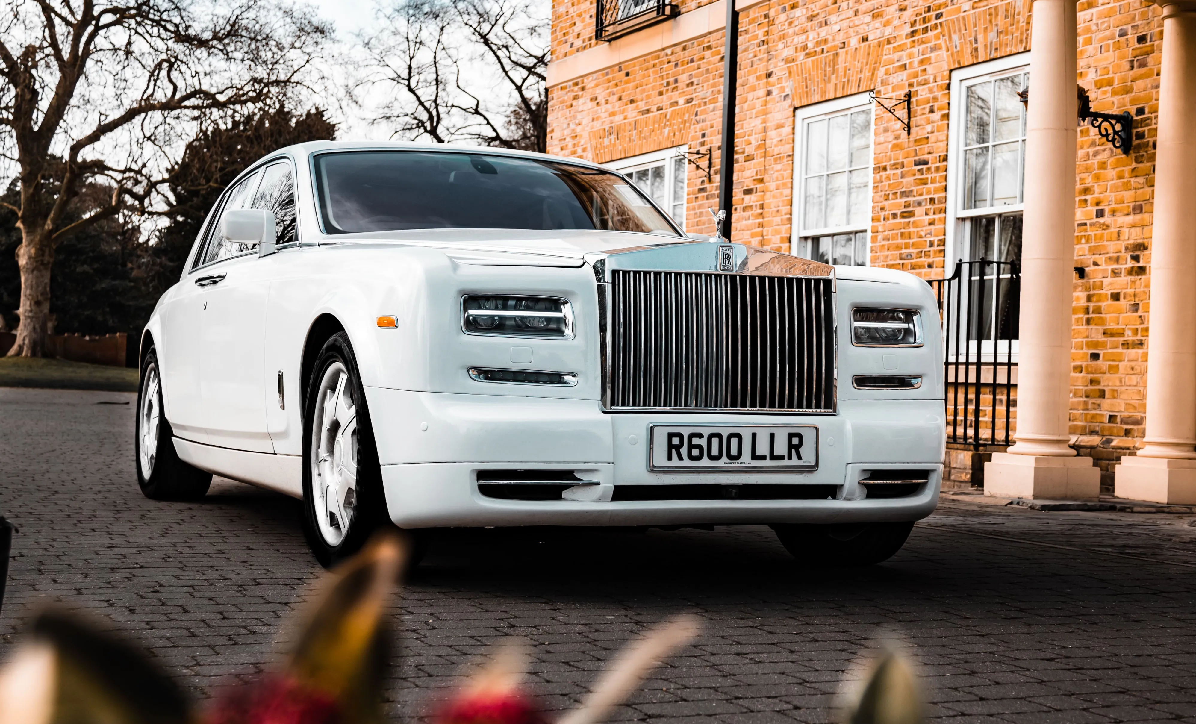 Modern White Rolls-Royce Phantom with Wedding Ribbons