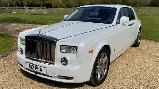 White Rolls-Royce Phantom view of front Rolls-Royce Grill and Spirit of Ecstasy