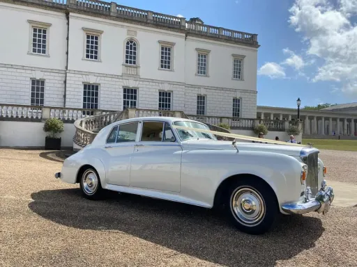 Classic Bentley at queen's house in Greenwich London. Decorated with cream ribbons