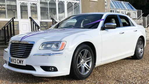 Modern White Saloon hwith purple ribbons on bonnet