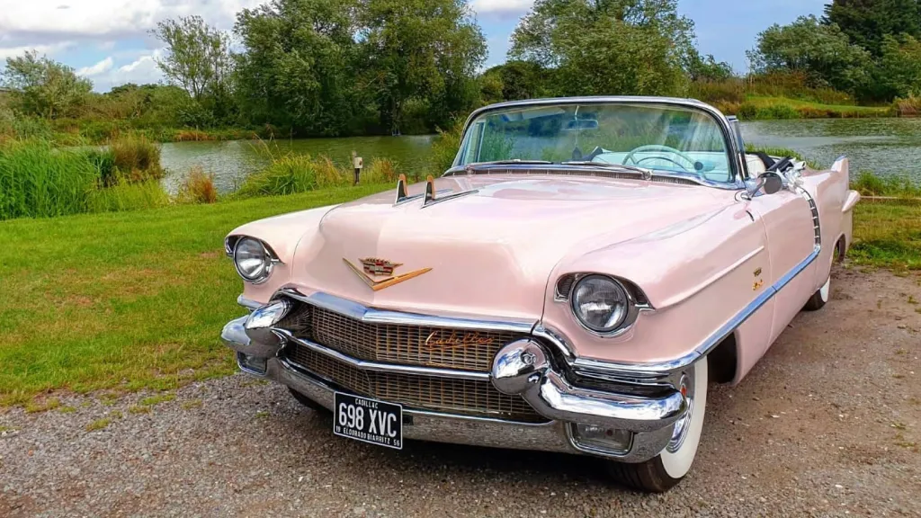 Classic Pink American Cadillac with roof open