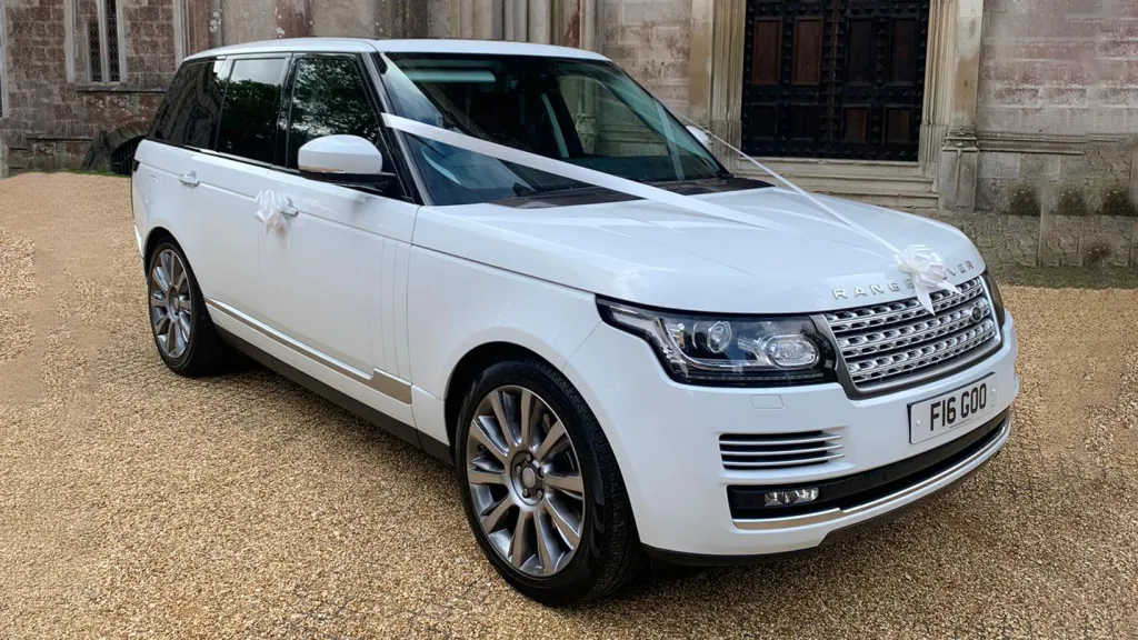 White Range Rover Vogue dressed with Traditional White ribbons on bonnet