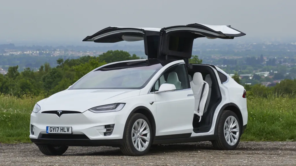 White Tesla X with both Gull-wing doors open