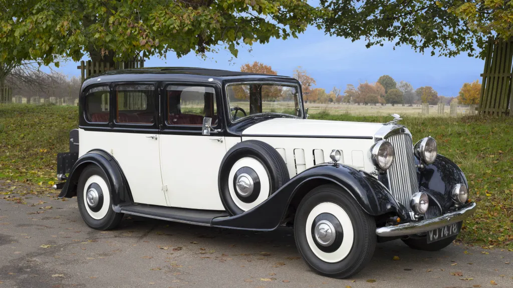 Side view of Black & Ivory Vintage Humber Car in a park