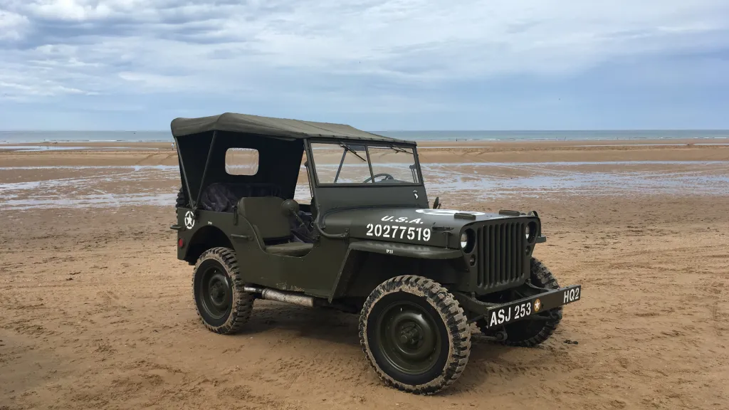 Army Green American Jeep on the beach