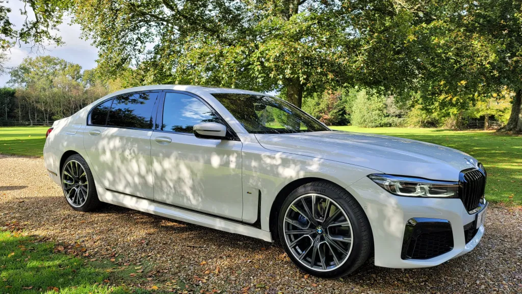 White Modern BMW in front of a wedding venue