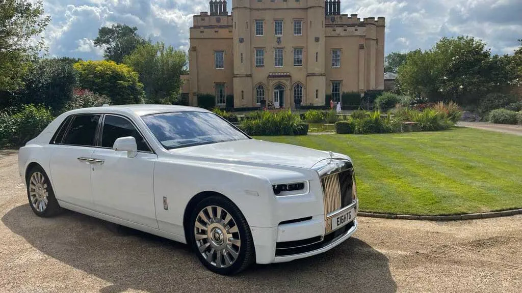 White Rolls-Royce Phantom 8 in front of wedding venue