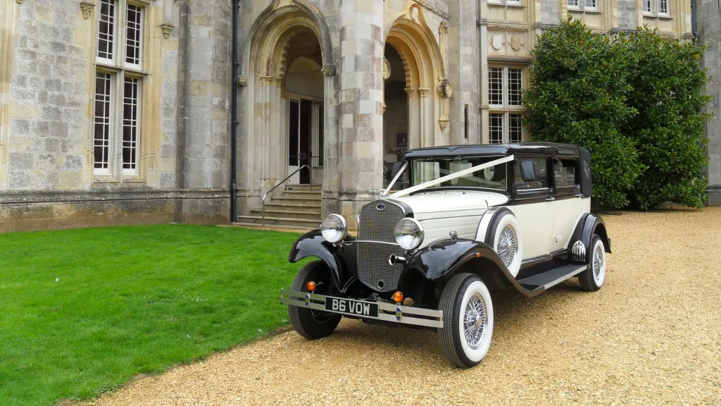 Black & Ivory vintage Brenchley convertible in front of wedding venue
