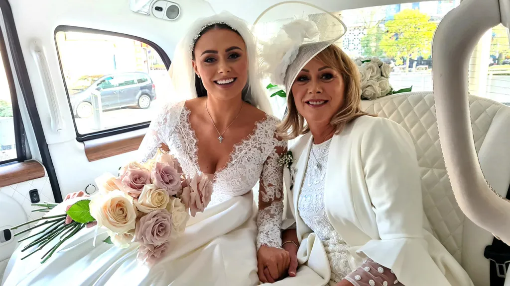 Bride and Bride's Mother inside Taxi Cab