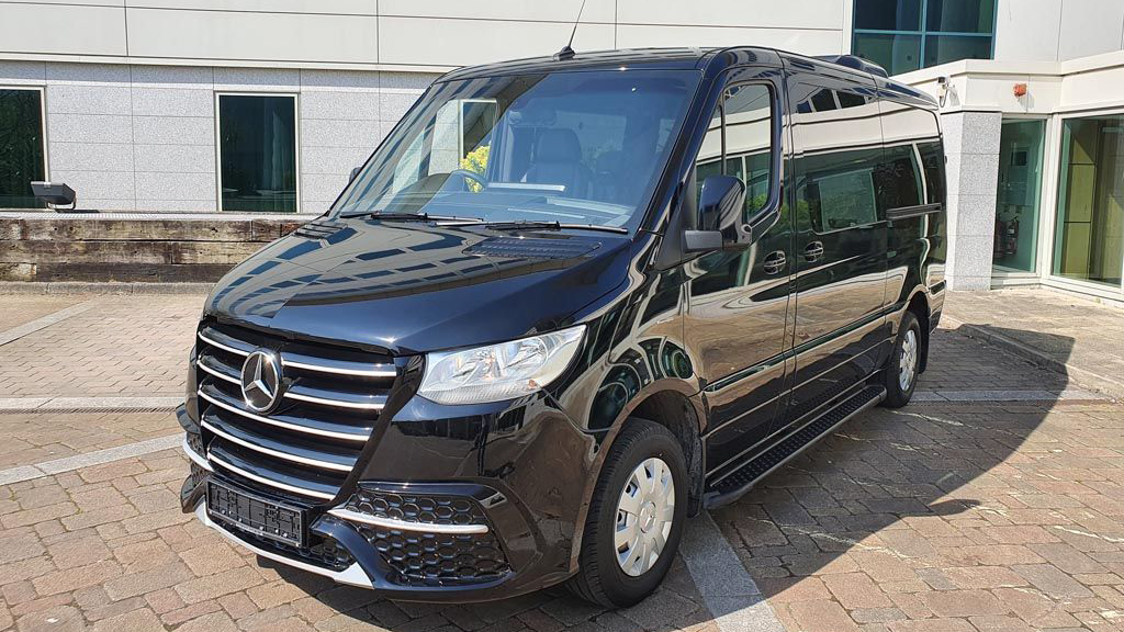 Front Side view of 9-seater Mercedes Bus in Black