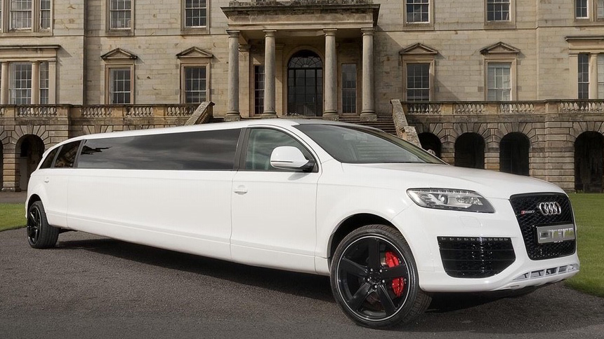 White Stretched Audi Limousine in front of a wedding venue in Midlands