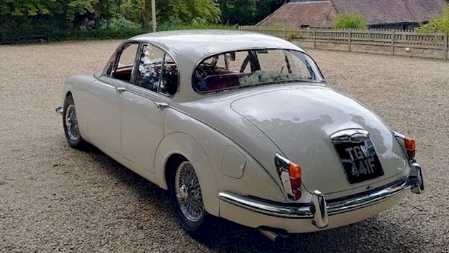 Rear view of a Classic Mk2 Jaguar showing the spokes alloy wheels and chrome bumper