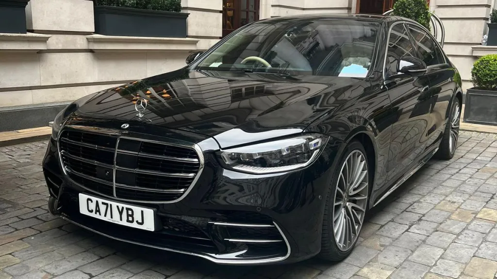 front view of Black Mercedes S-class showing the large Mercedes Grill