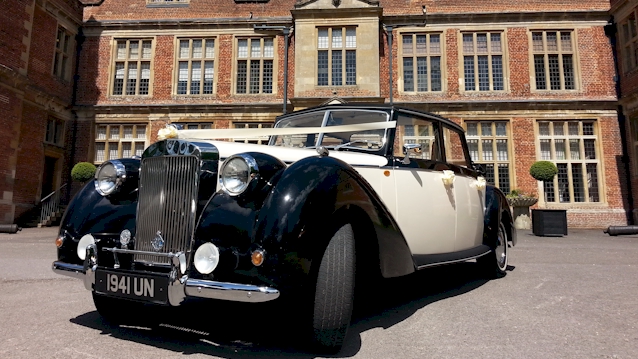 xFront view of Convertible Vintage Royale ion front of wedding venue in Reading