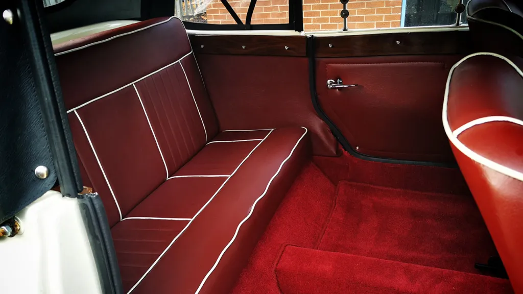 rear interior showing the read leather seat and carpet