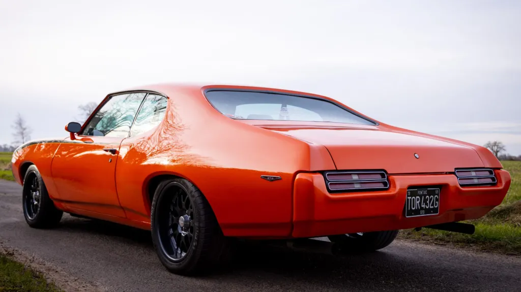 Rear side view of American Pontiac GTP in orange