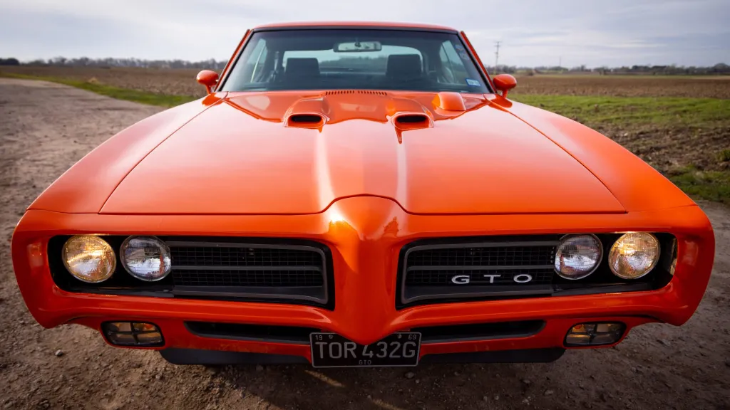 Full front view of Pontiac GTO with twin headlights on