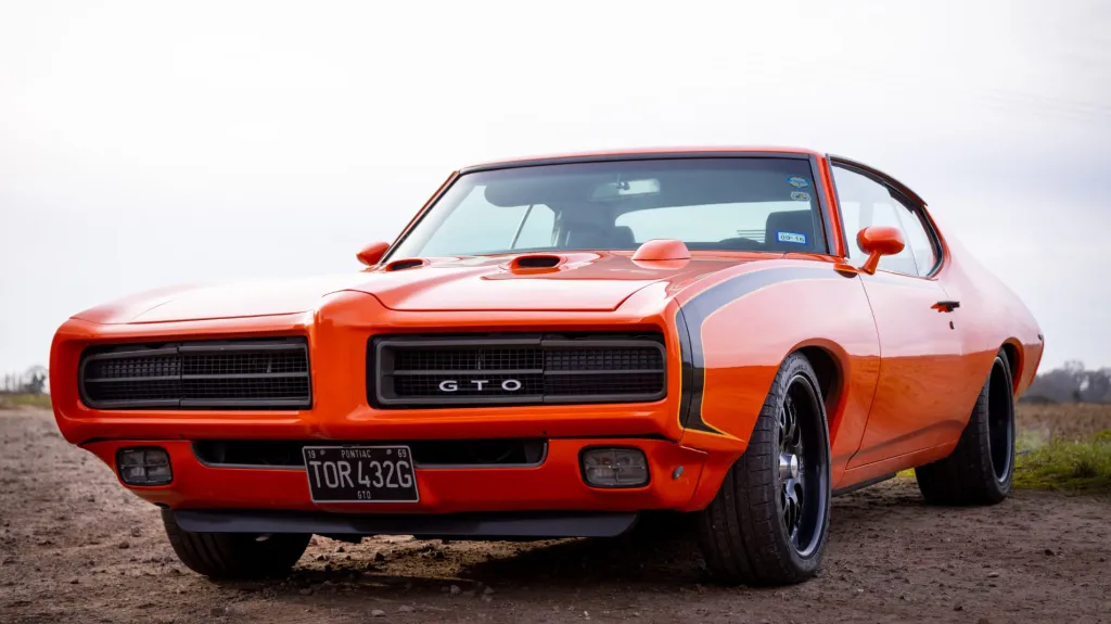 Front Side view of Orange Classic American Pontiac GTO