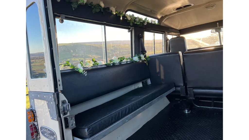 Inside Bench Seat facing each other with wedding flower decoration