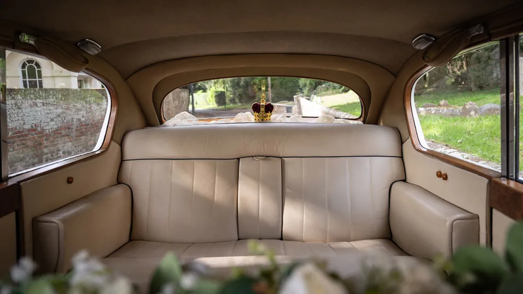Rear inside of Austin Princess with Cream leather and wedding flower decoration