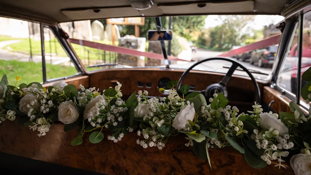 Foliage and white flower sample fitted between the rear and front compartment