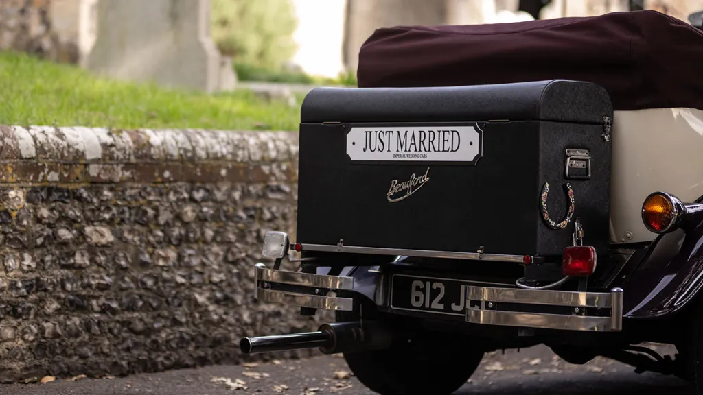 Side rear view showing the rear picnic trunk with "just Married" sign