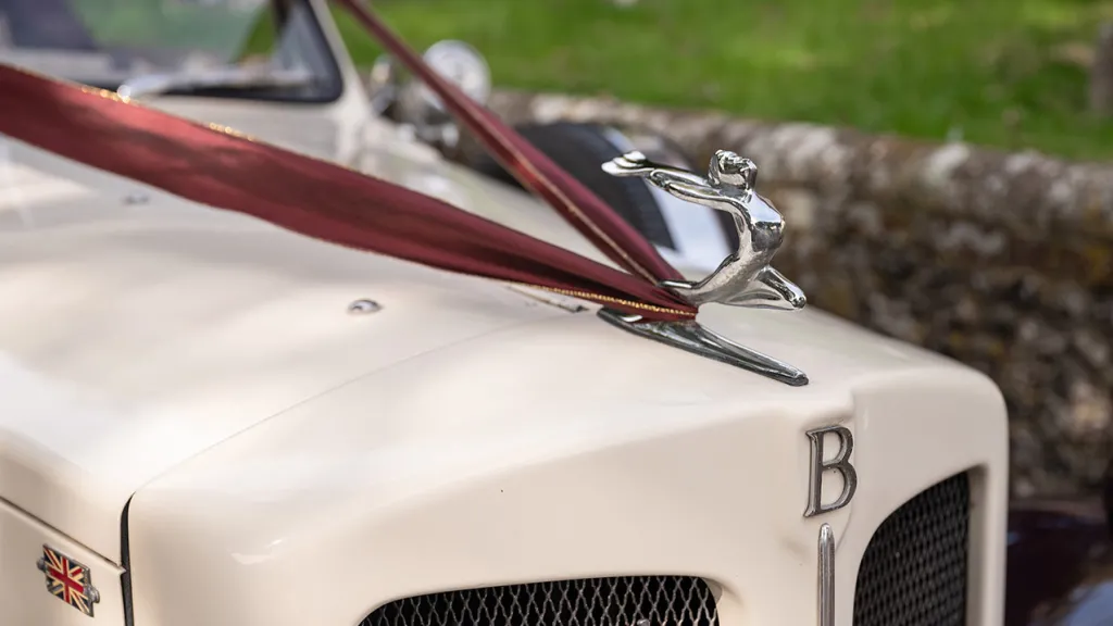 Close up view of Beauford Mascot on front bonnet with Burgundy Ribbon