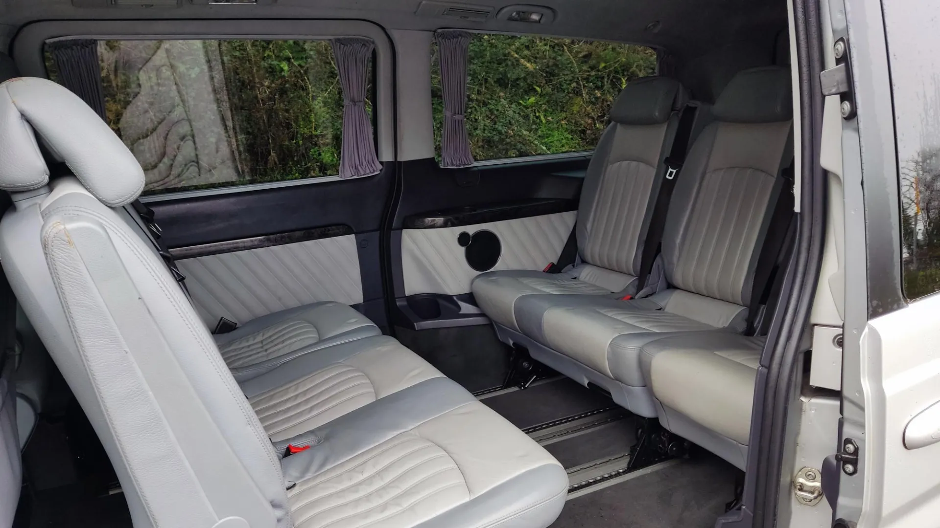 rear cream leather interior of Mercedes Viano showing 6 seats facing each others