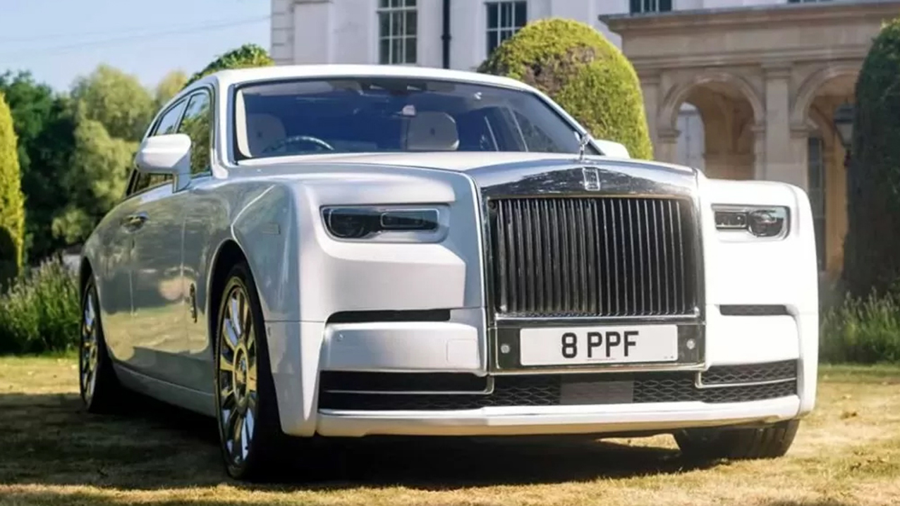 Front Side view of White Rolls-Royce phantom 8 in the garden of a popular wedding venue in Essex