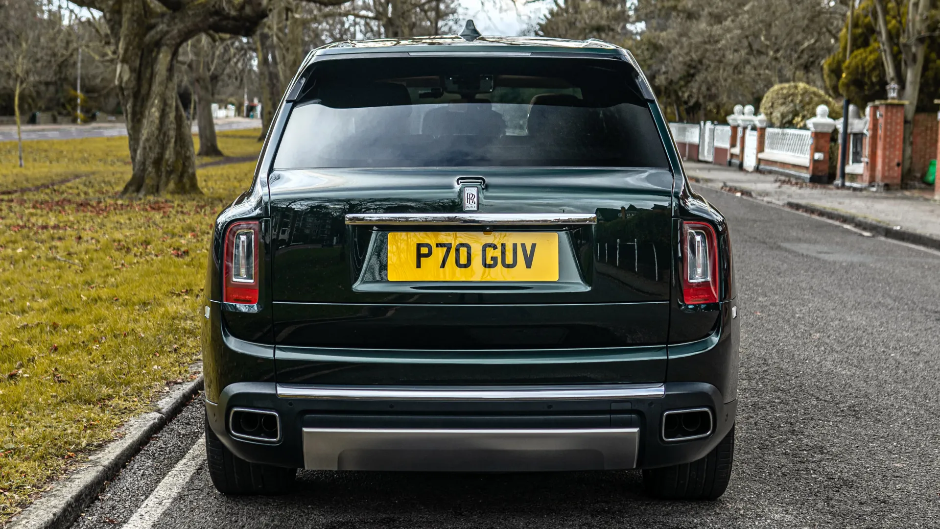 Full Rear view of Dark Green Rolls-Royce Cullinan in the street of London