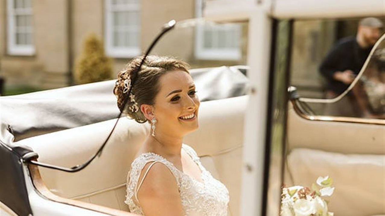 Bride seating in the Classic austin Princess with roof down