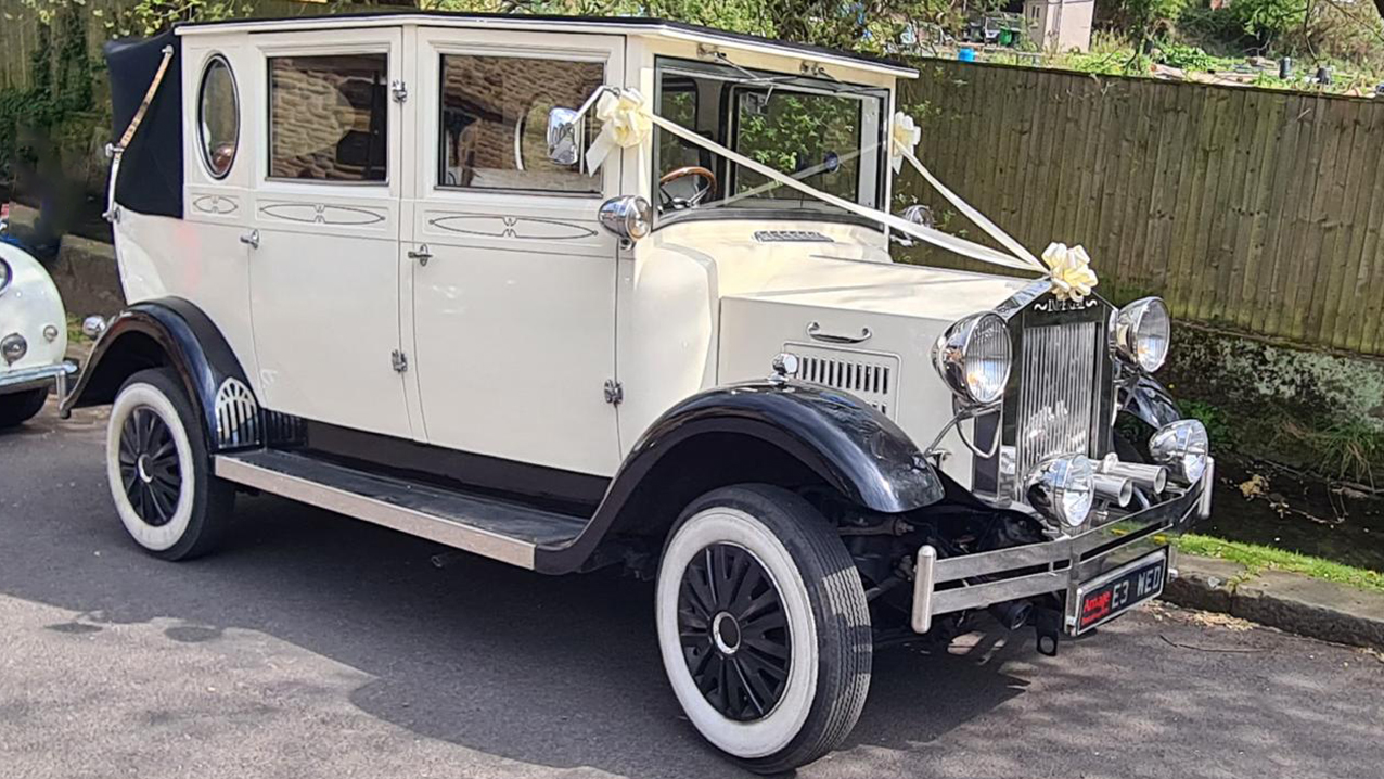 Vintage Bramwith Landaulette with black convertible roof close