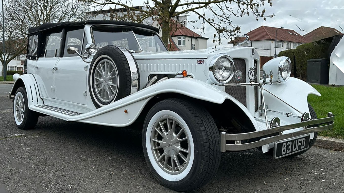 White beauford 4-Door Convertible with white wall tires